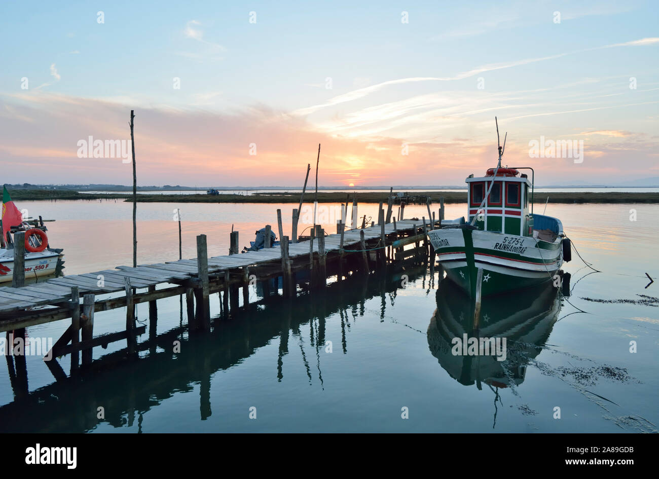 A fishing harbour on stilts. Carrasqueira at dusk. Alentejo, Portugal Stock Photo