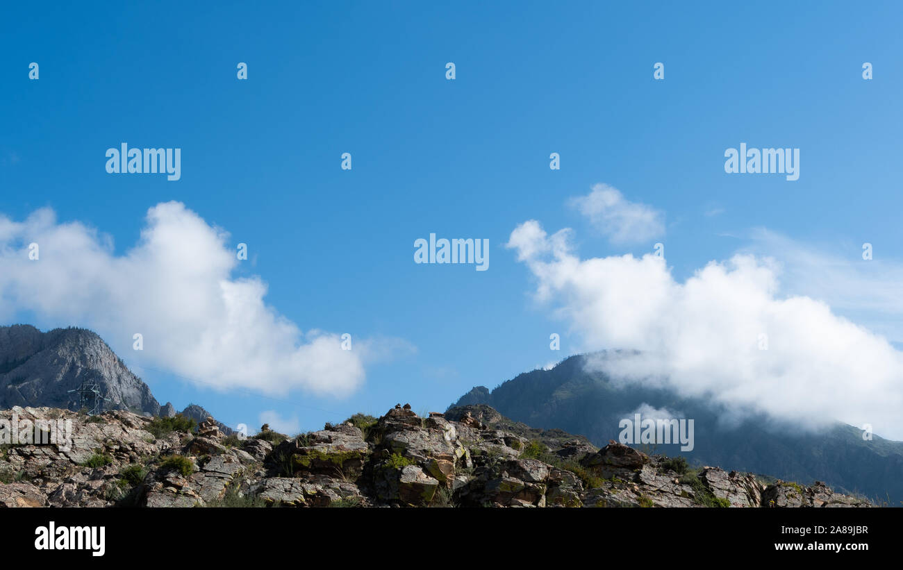 Rocks under blue sky with clouds. Mountain Hiking, summer tourism Stock ...