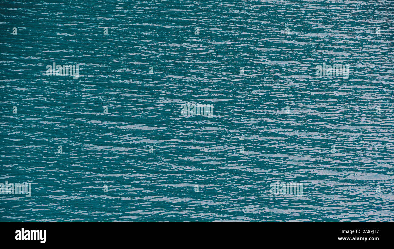 Smooth surface of lake with blue water, turquoise sea as background Stock Photo