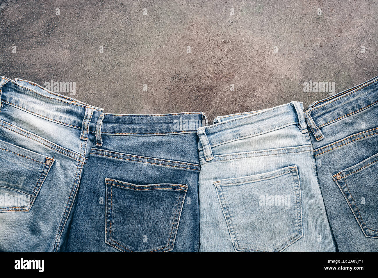 Flat lay collection of fashionable denim blue jeans, border. Top view, flat  lay, copy space Stock Photo - Alamy