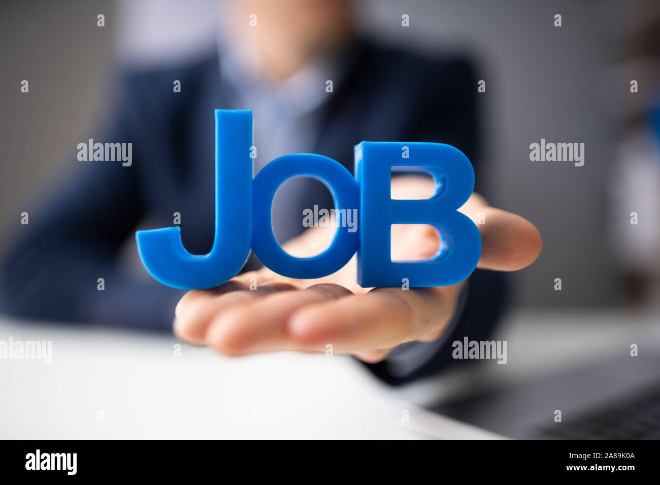 Close-up Of Businessman's Hand Giving Job Text Stock Photo - Alamy