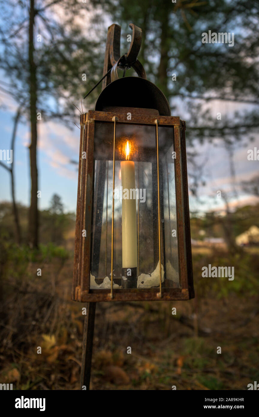 An Old Fashioned Candle Lit Lantern During Early Evening Hours Stock Photo Alamy