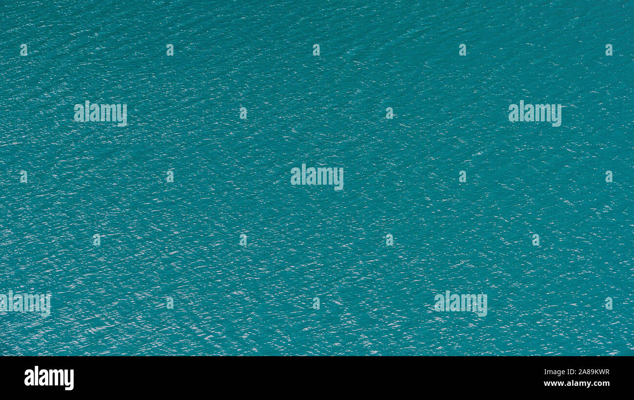 Smooth surface of lake with blue water, turquoise sea as background Stock Photo