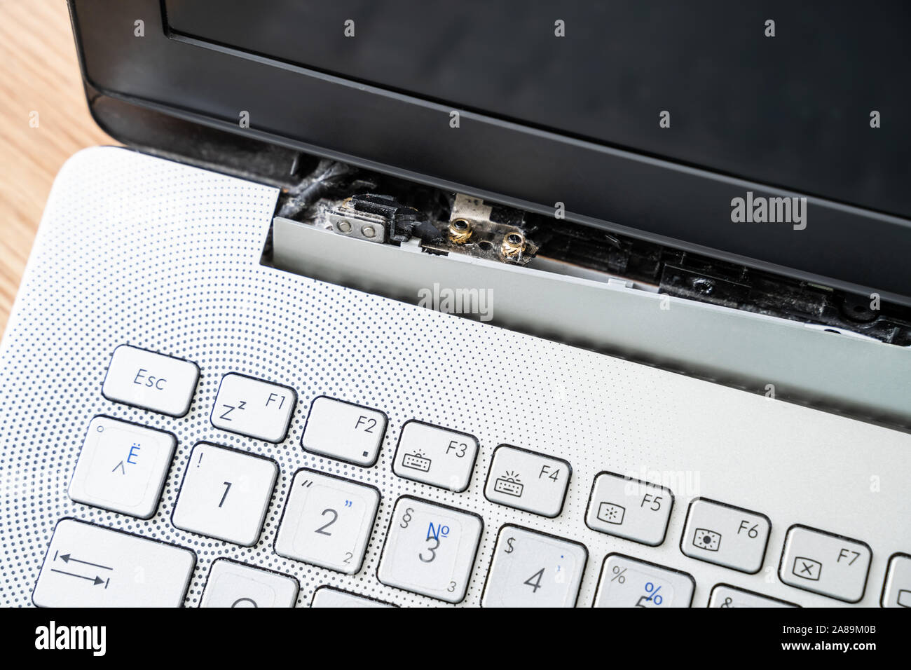 Damaged Laptop Computer With Broken Screen Attachment Stock Photo