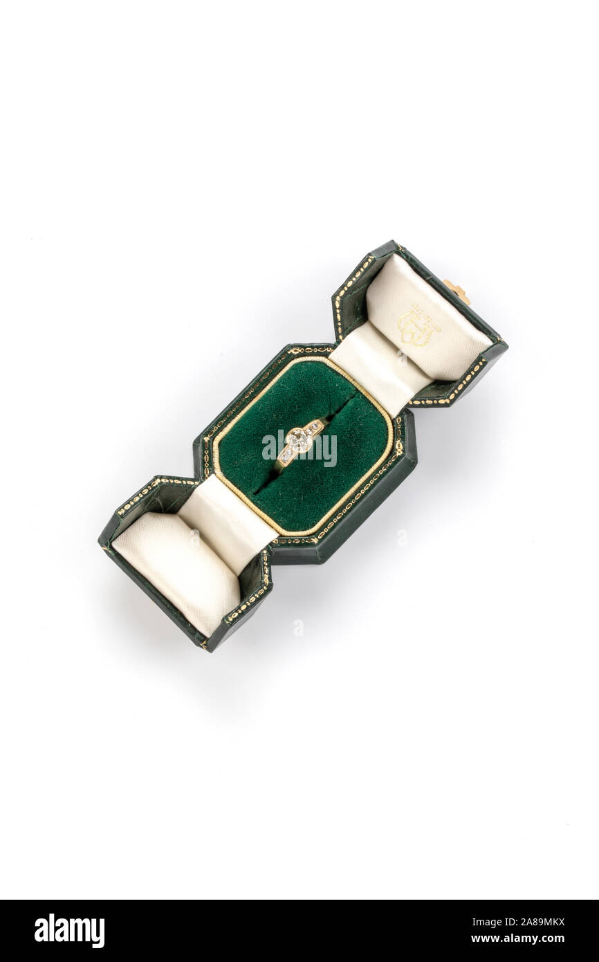 Diamond and gold ring in green box. Stock Photo