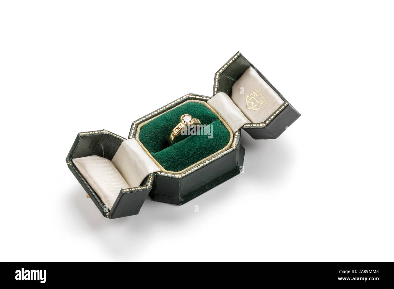 Diamond and gold ring in green box. Stock Photo