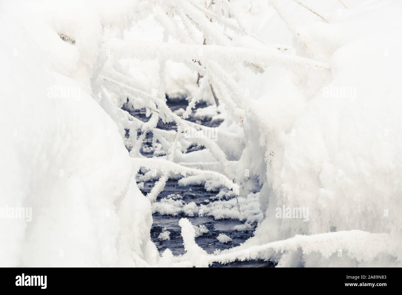 Winter Creek under snow cover Stock Photo