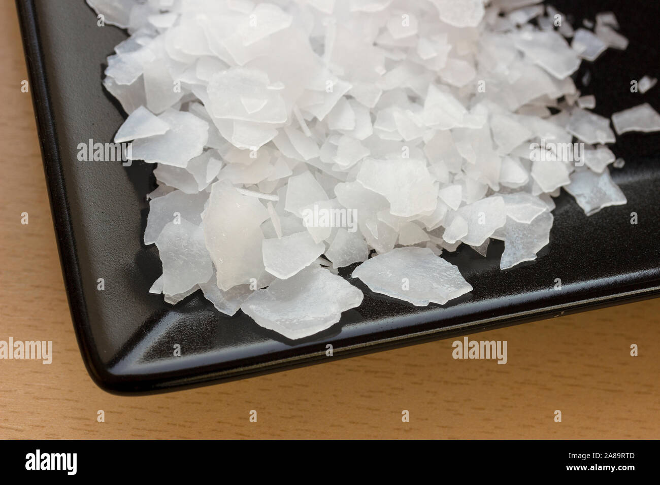 Magnesium chloride flakes -sea salt - close up Stock Photo