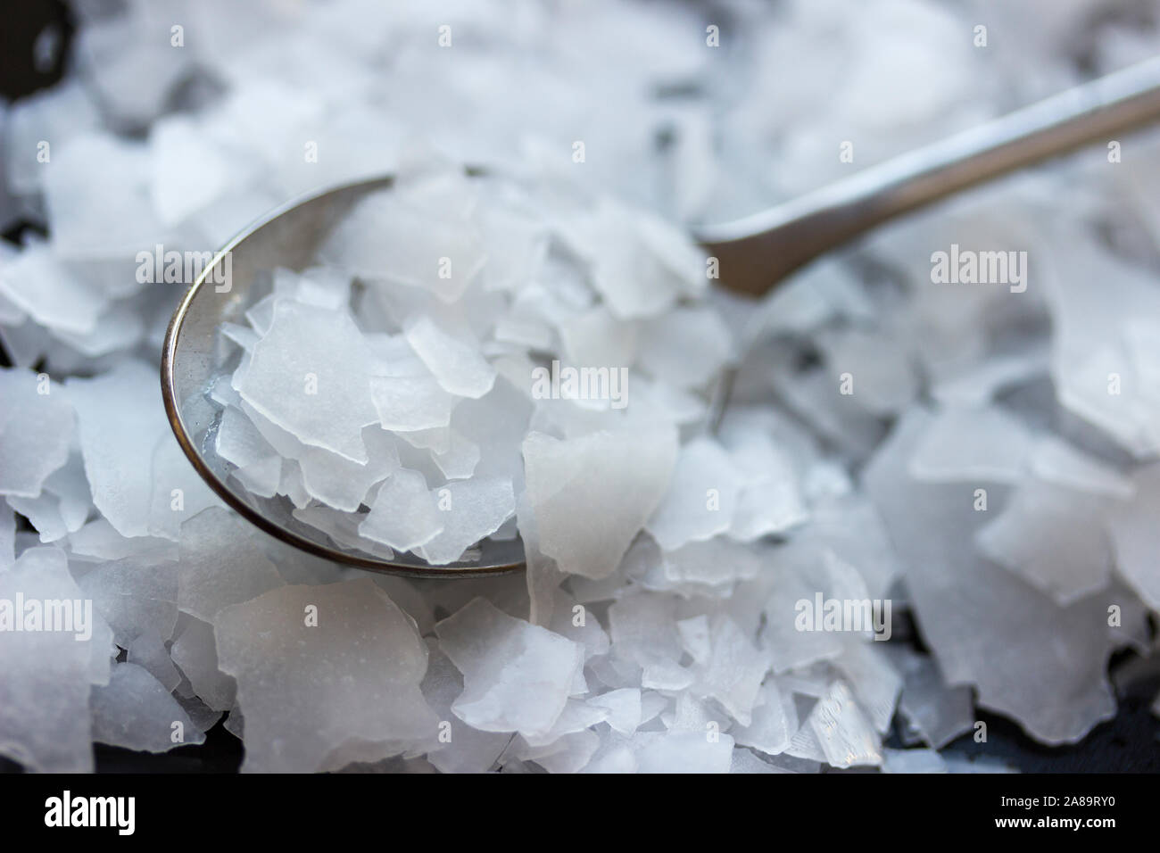 Magnesium chloride flakes -sea salt - close up Stock Photo