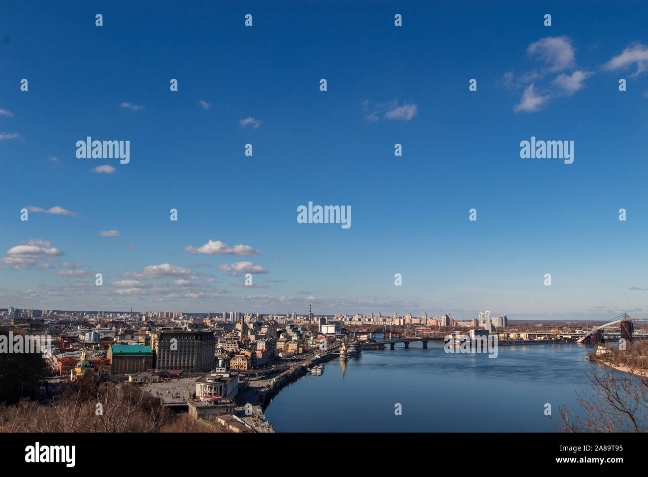 View of the metropolis from a height. City of Kiev, Ukraine. The Dnieper River flowing through the center of Kiev. Stock Photo