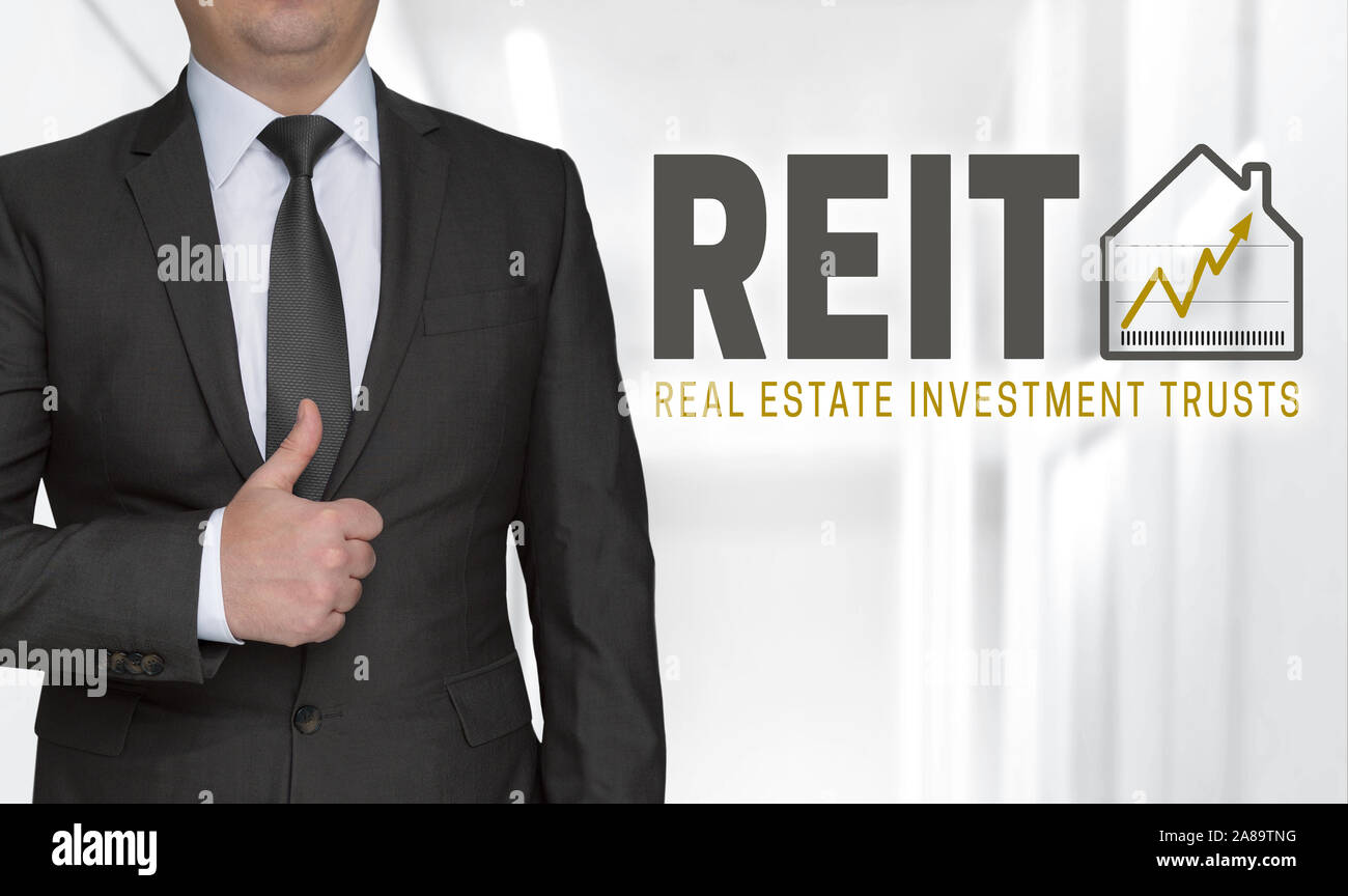 REIT concept and businessman with thumbs up. Stock Photo