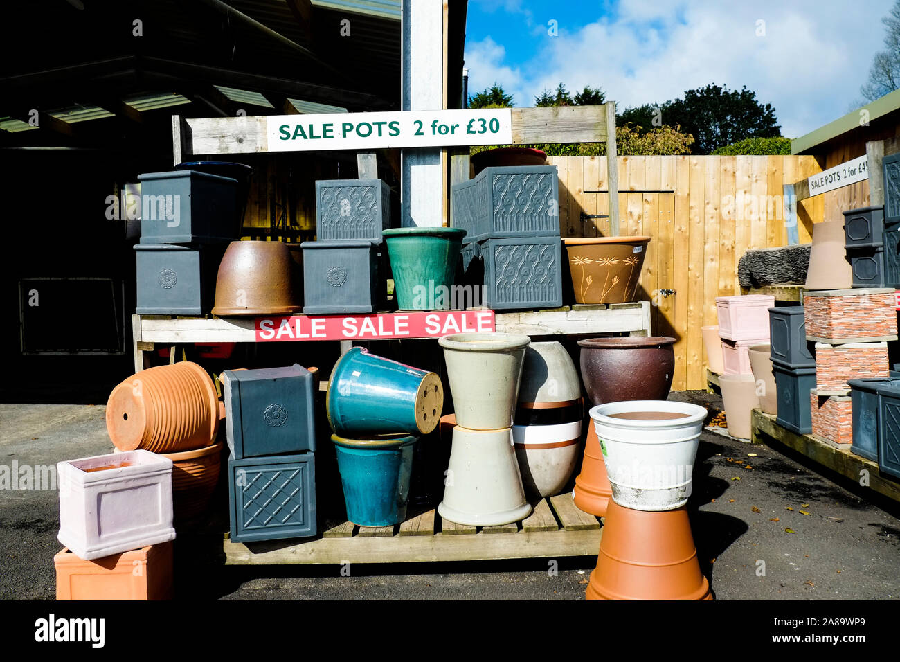 Various ceramic pots and plant containers on sale in a garden nursery centre. Stock Photo