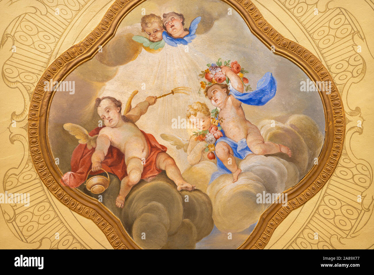 MENAGGIO, ITALY - MAY 8, 2015: The neobaroque  fresco of angels with the holy water in church Chiesa di Santa Marta. Stock Photo