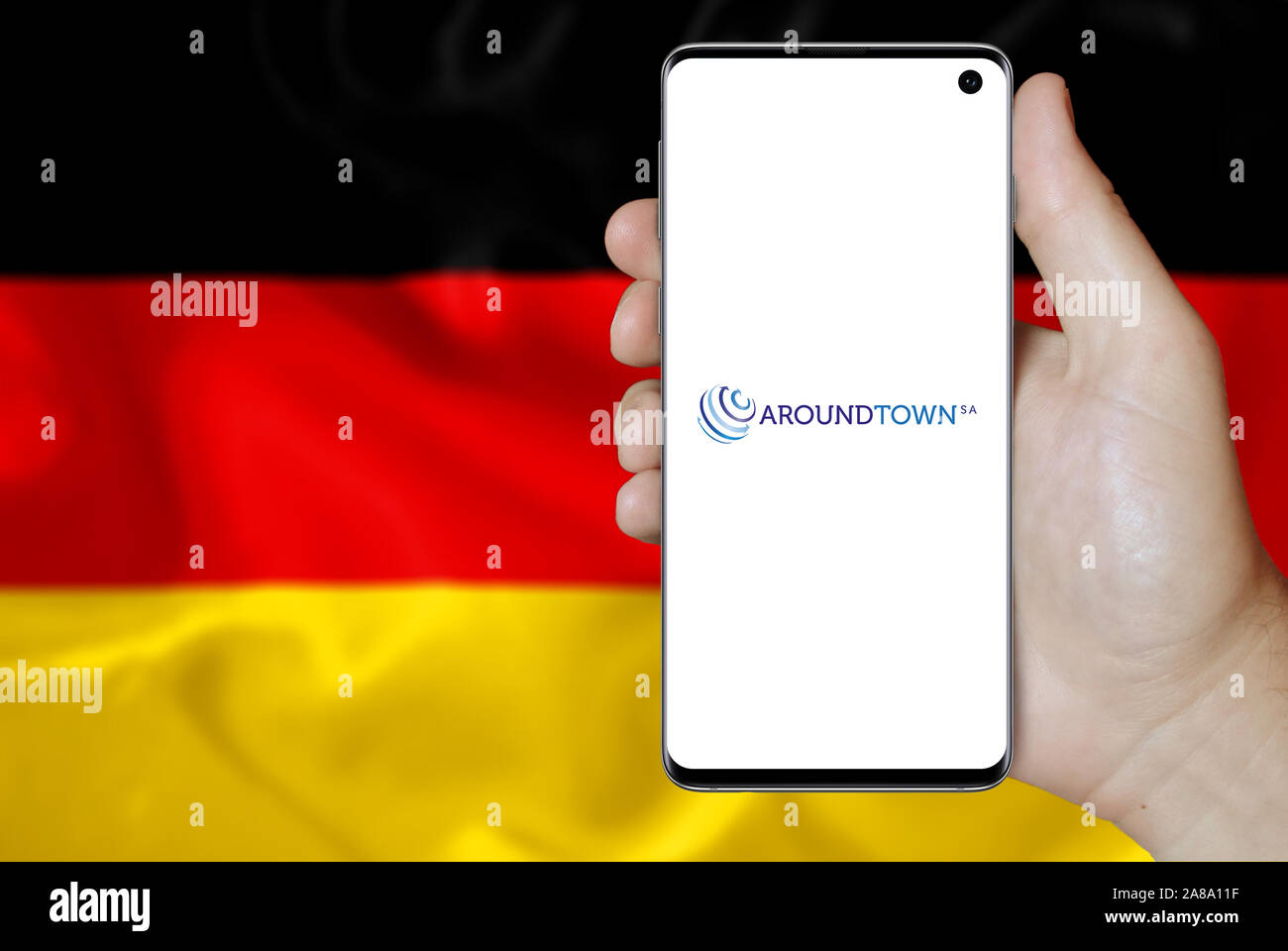 Logo of public company Aroundtown SA displayed on a smartphone. Flag of Germany background. Credit: PIXDUCE Stock Photo