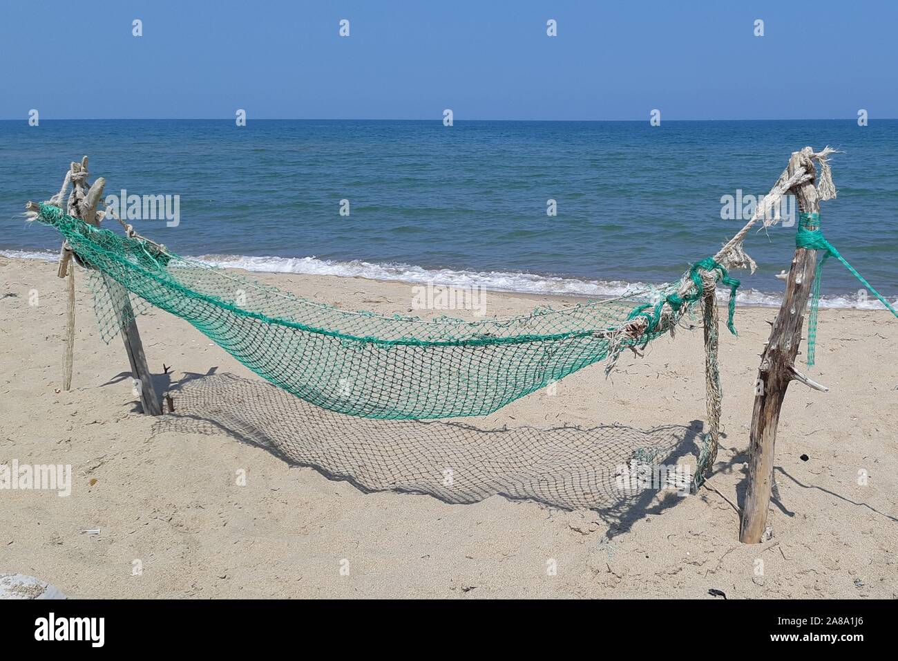 Hammock built on the beach near the sea Stock Photo Alamy