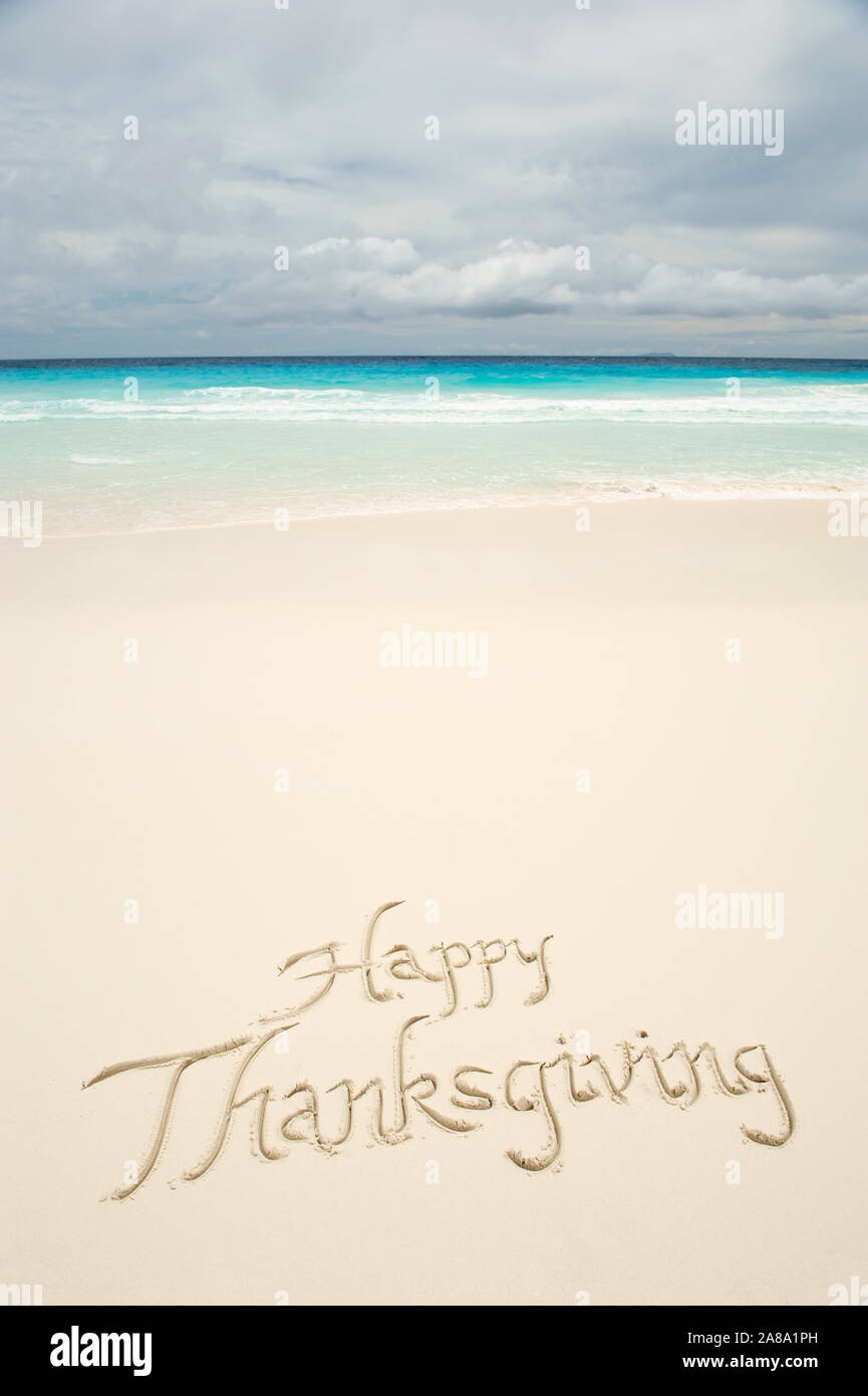 Tropical Happy Thanksgiving Travel Message Handwritten In Calligraphy On Smooth Sand Beach Stock Photo Alamy