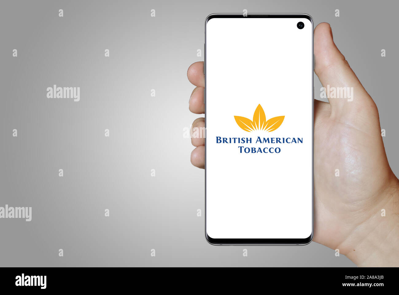 Logo of public company British American Tobacco displayed on a smartphone. Grey background. Credit: PIXDUCE Stock Photo
