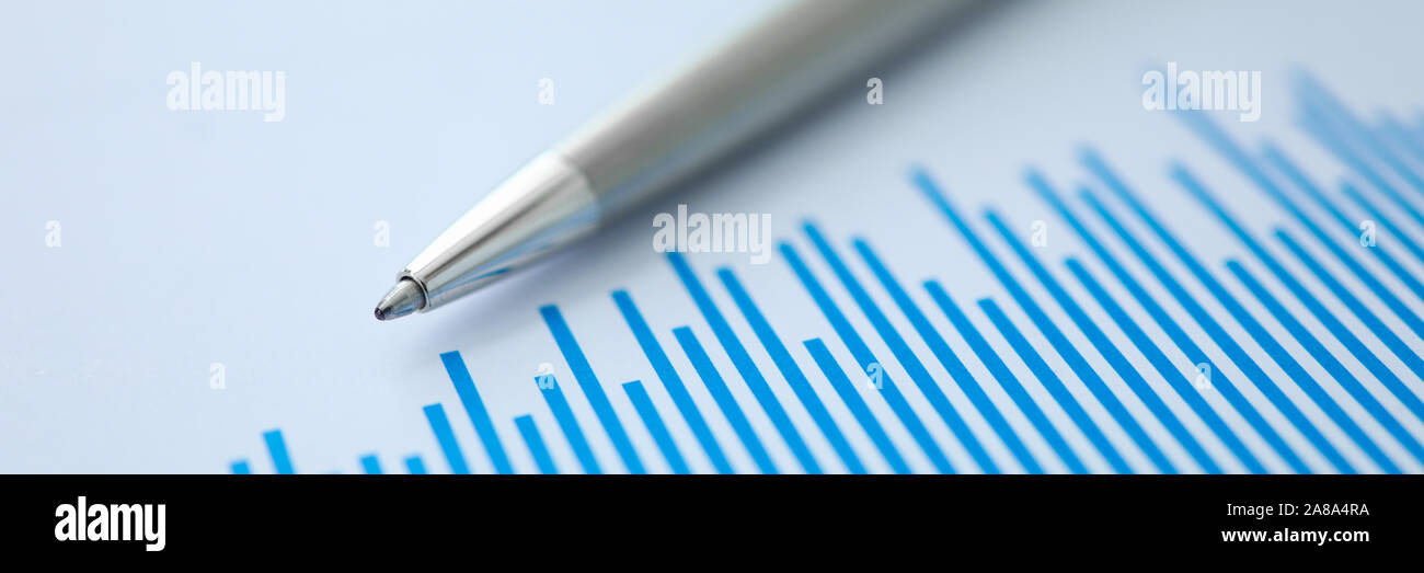 Silver pen lies on paper documents with color Stock Photo