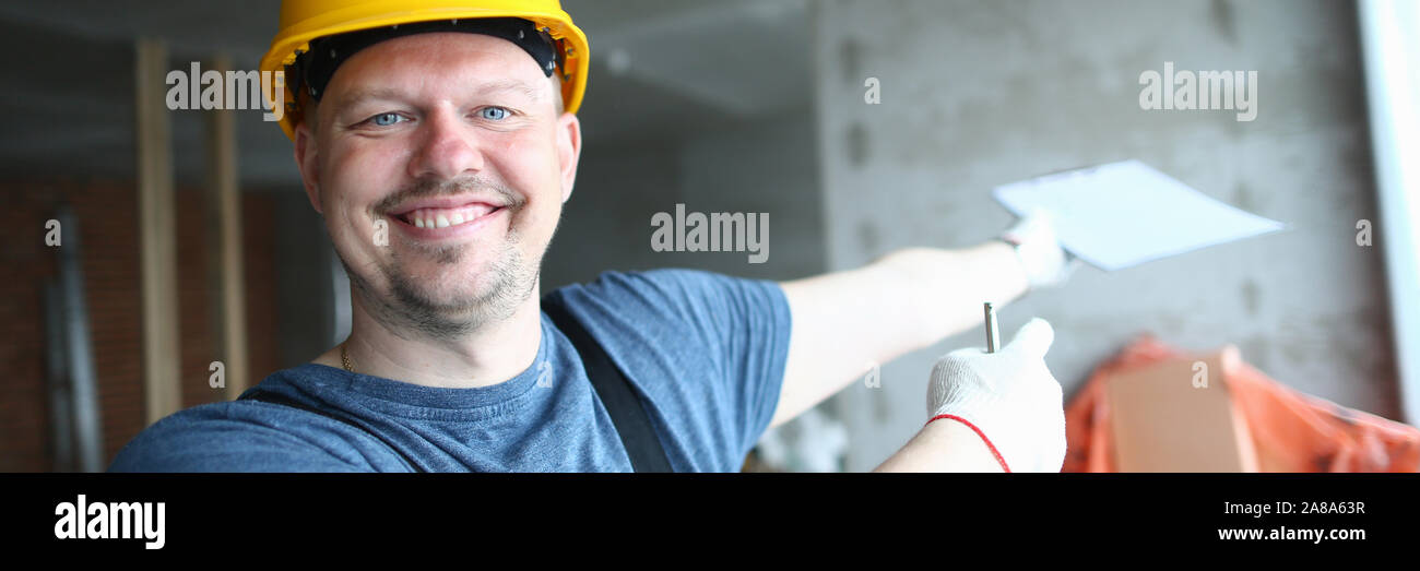Cheerful builder looking at camera Stock Photo