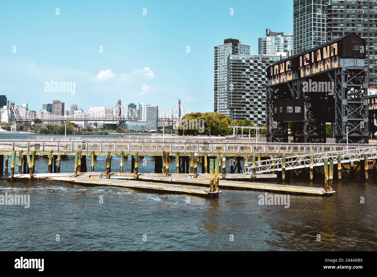 Ferry Dock at Long Island on a sunny day. Transportation and travel concept. Brooklyn, New York City, USA. Stock Photo