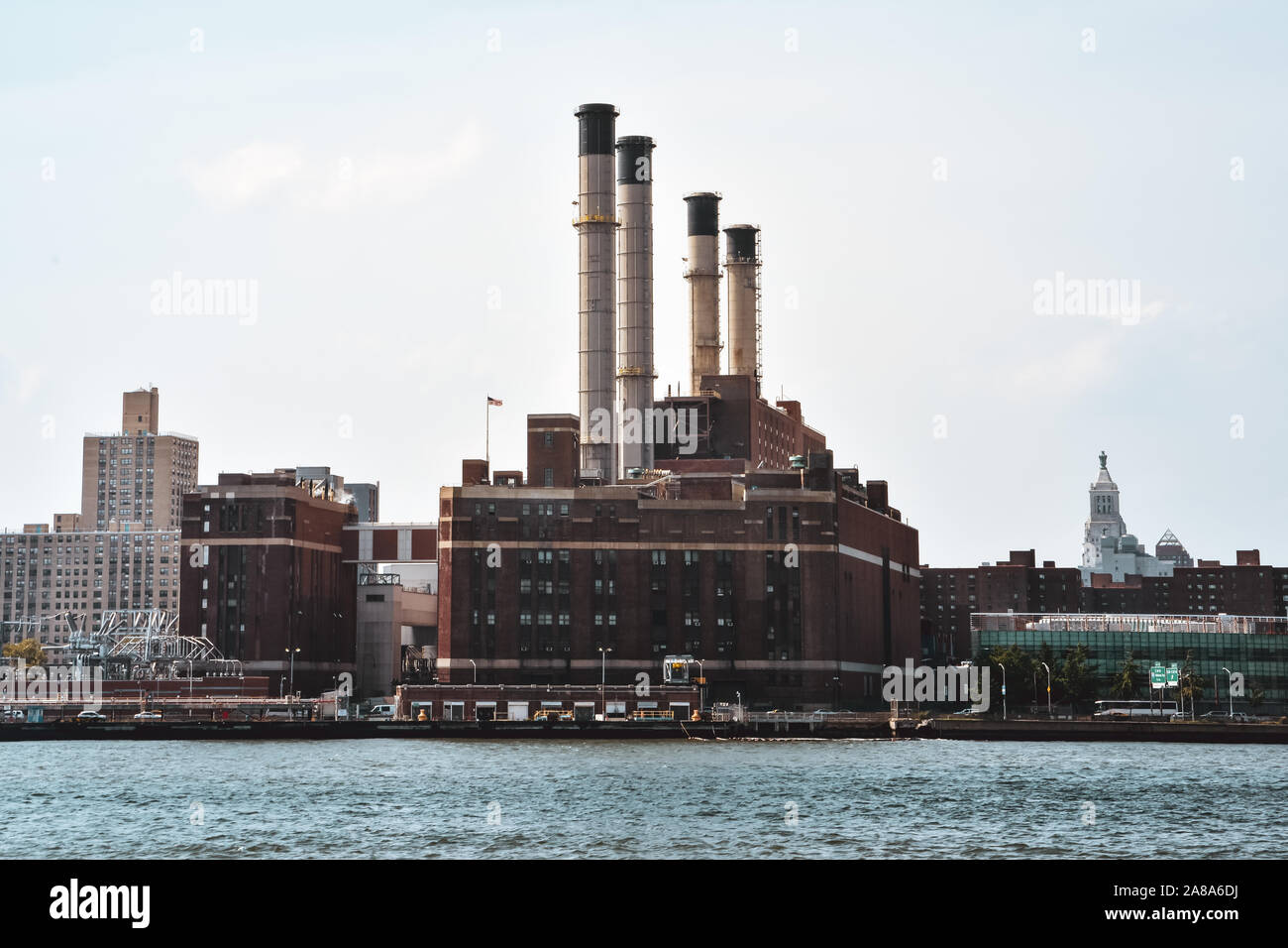 Office, apartments and industrial chimneys buildings in the skyline at