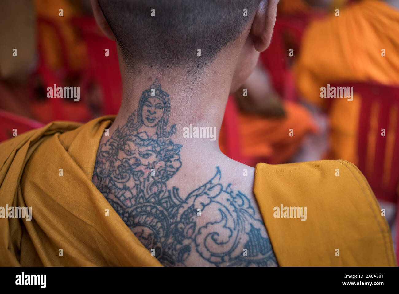 View of a tattooed back of a Buddhist monk, Angkor Wat, Siem Reap, Cambodia  Stock Photo - Alamy, image size:1300x957