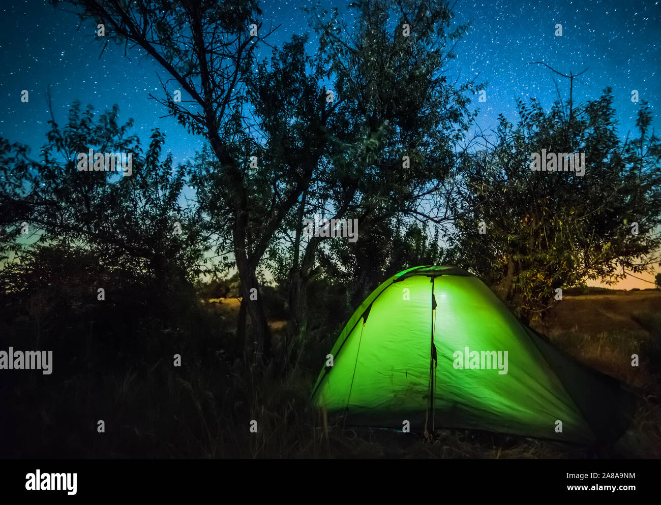 Bright tourist tent under starry sky Stock Photo - Alamy