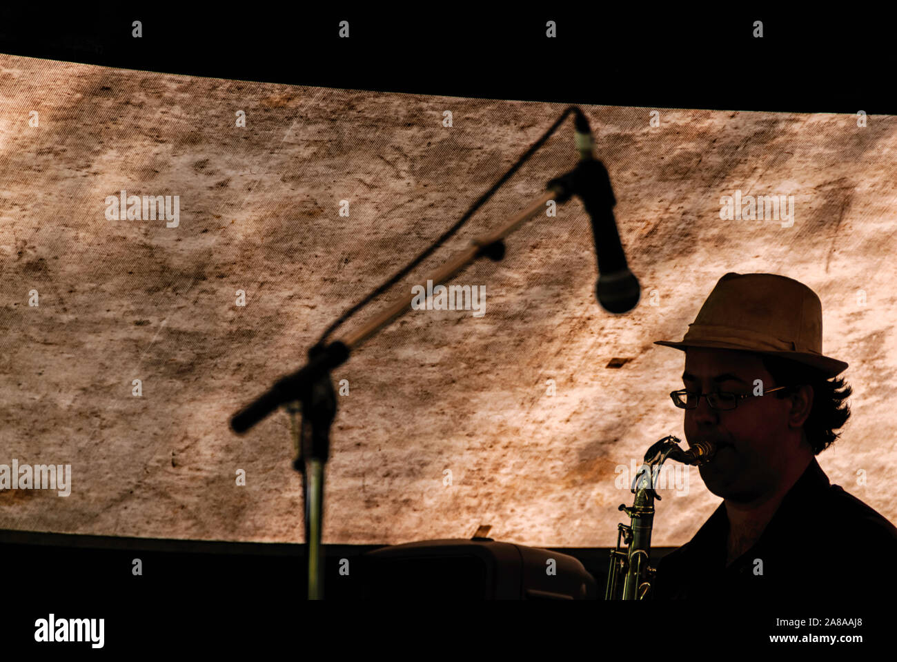 Saxophone player with microphone at the Calgary Jazz Festival Canada