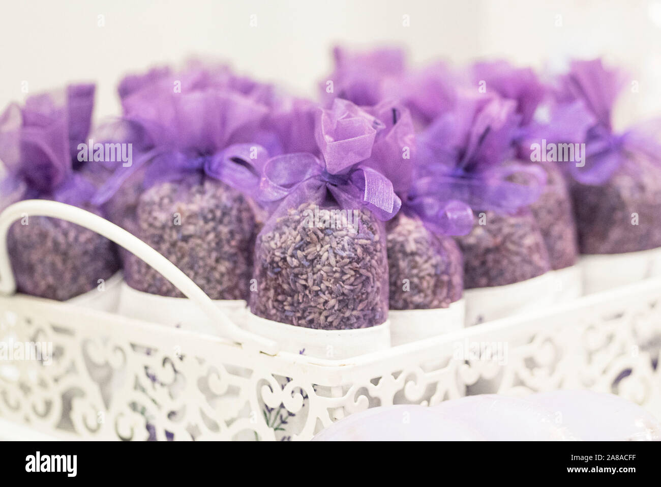 Fresh Dried Lavender Scented Sachets in Small Purple Organza Bags. Selective focus. Stock Photo