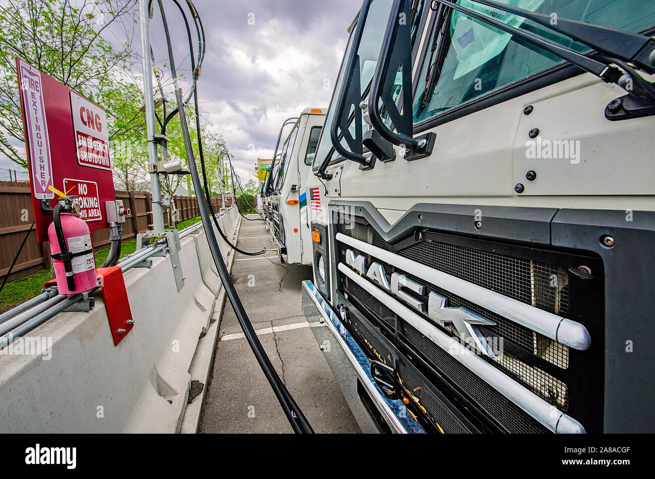 CNG-powered (compressed natural gas) Mack trucks line up at Waste Pro’s time-fill station, March 19, 2016, in Jacksonville, Florida. Stock Photo
