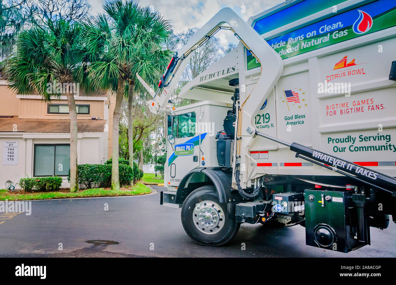 A Waste Pro Mack Titan collects garbage in the La Vista community, March 18, 2016, in Sanford, Florida. Stock Photo