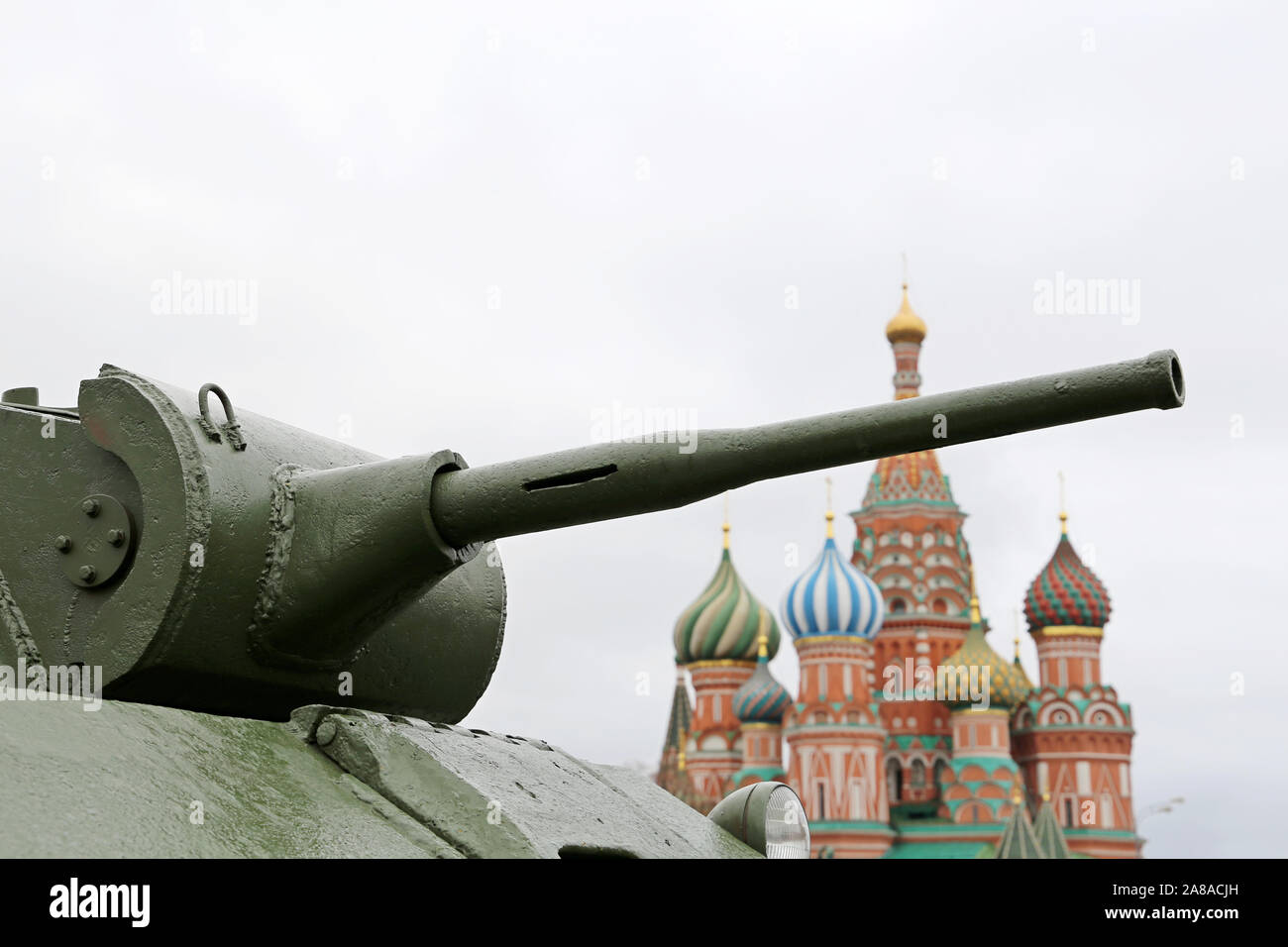 Tank gun on Red square in Moscow on background of St. Basil's Cathedral. Concept for russian military and weapons, 23 February celebration Stock Photo