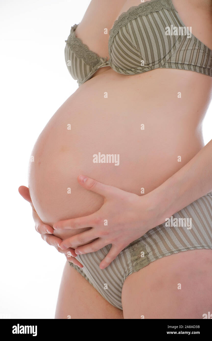 Schwangere Frau zeigt ihren Bauch, 9. Monat, Schwanger, Stock Photo