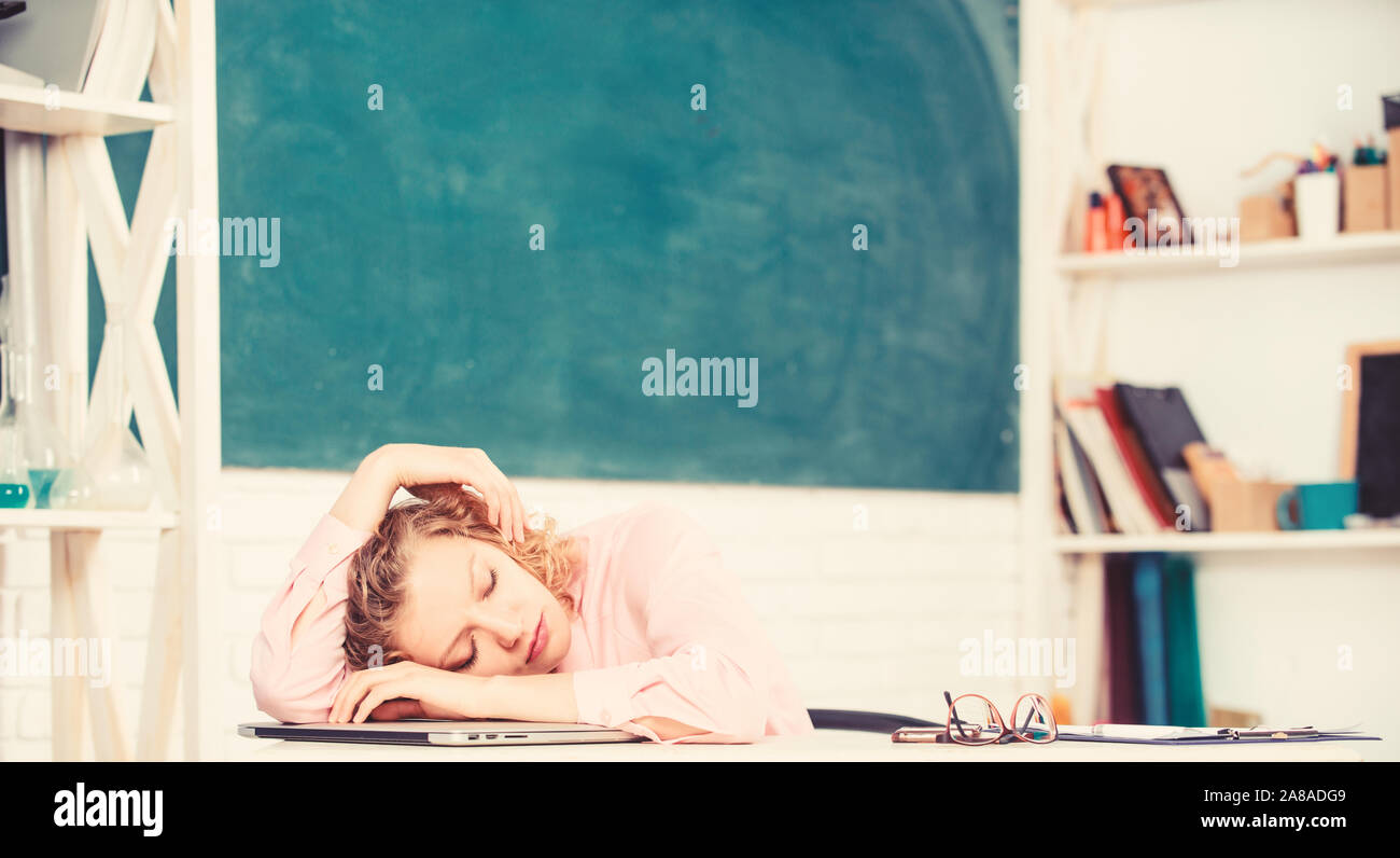 Tired tutor fall asleep at workplace. Tired student lean on desk