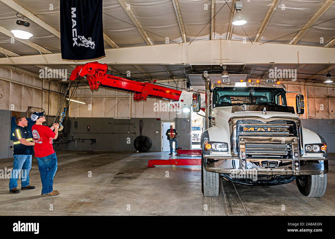 Matthew Adams works with the boom of a 2016 Mack Granite with a 50-ton Century rotator at Mike Adams Towing and Air Cushion Recovery in Macon, Georgia. Stock Photo