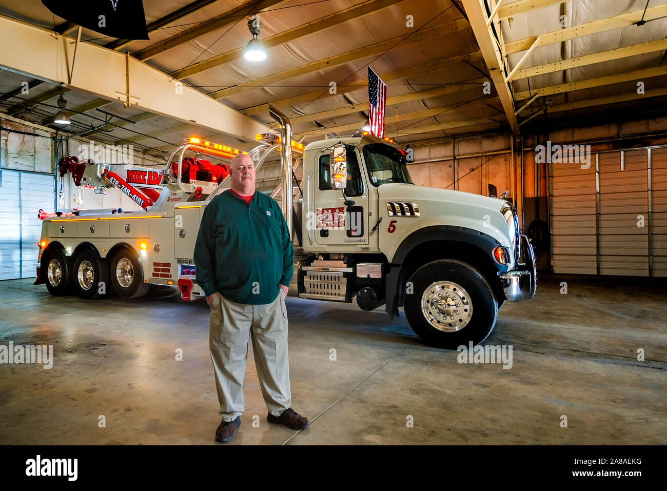 Mike Adams, of Mike Adams Towing and Air Cushion Recovery, is pictured with his newest truck, a 2016 Mack Granite with a 50-ton Century rotator. Stock Photo