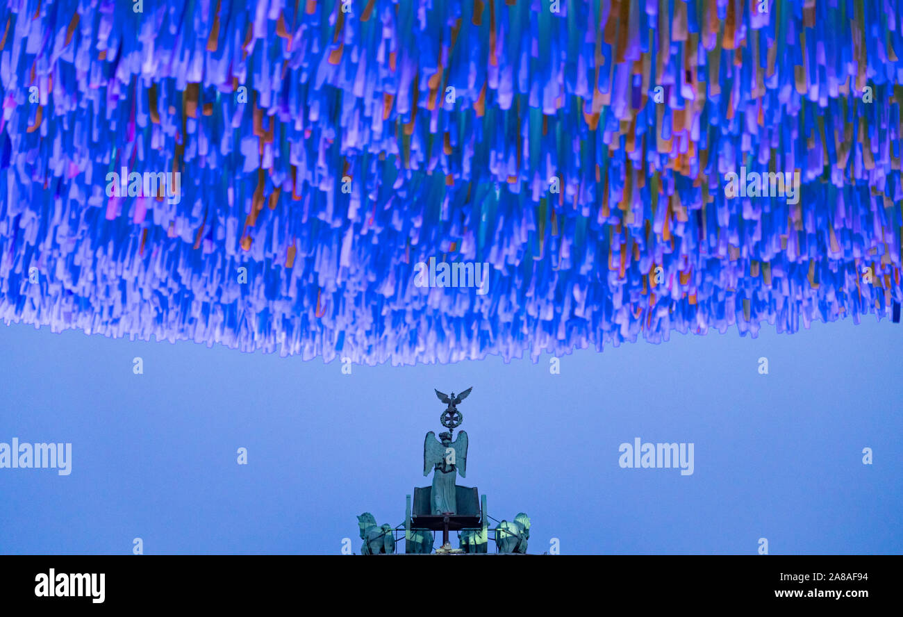 Berlin, Germany. 7th November 2019.  Art installation Visions in Motion by Patrick Shearn of Poetic Kinetics with coloured ribbons for visitors to write messages on in front of the Brandenburg Gate, to mark the 30th Anniversary of the fall of the Berlin Wall.  Iain Masterton/Alamy Live News. Stock Photo