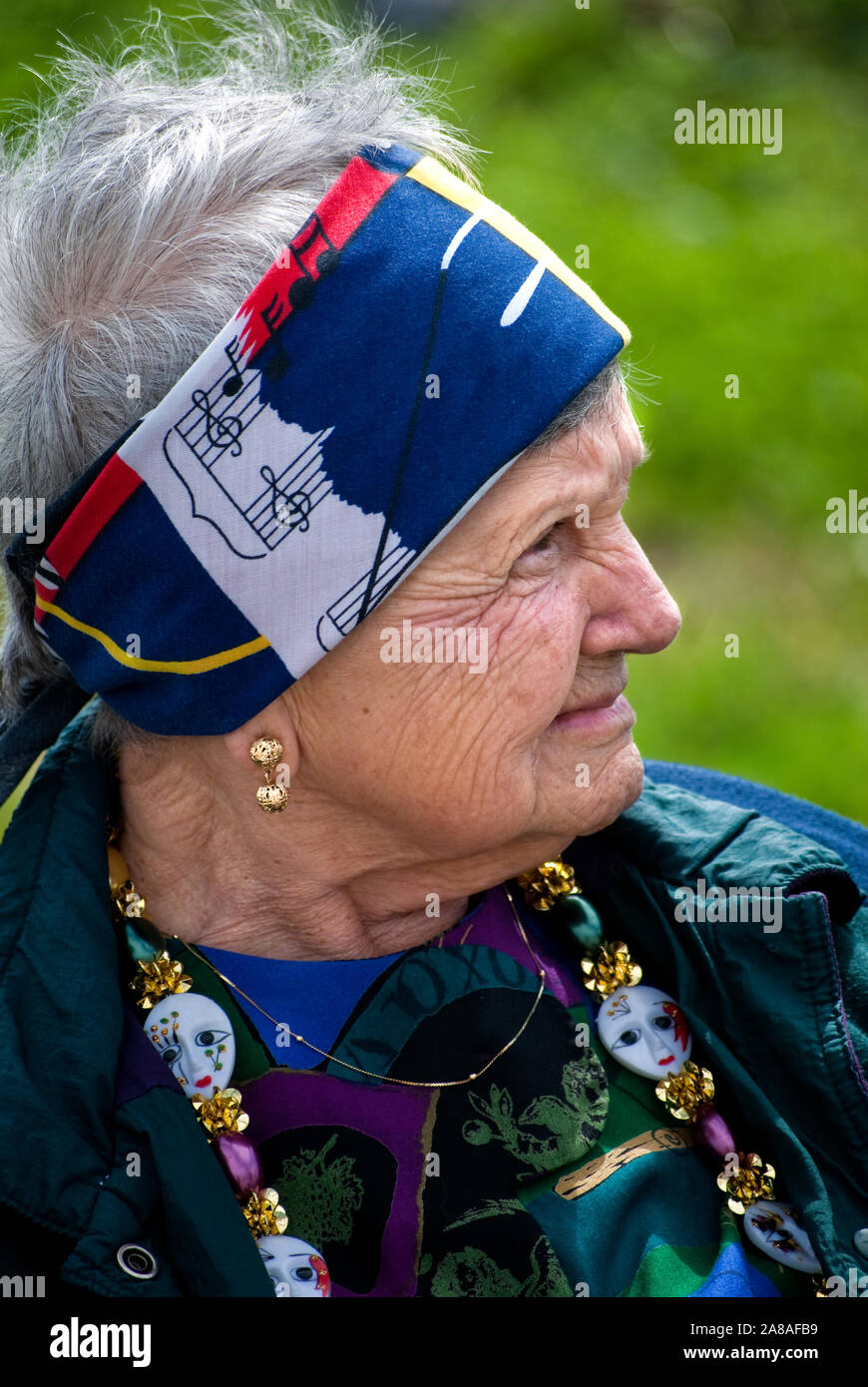 A woman smiles as she watches the annual Mardi Gras parade March 6, 2011 in Grand Isle, Louisiana. Stock Photo