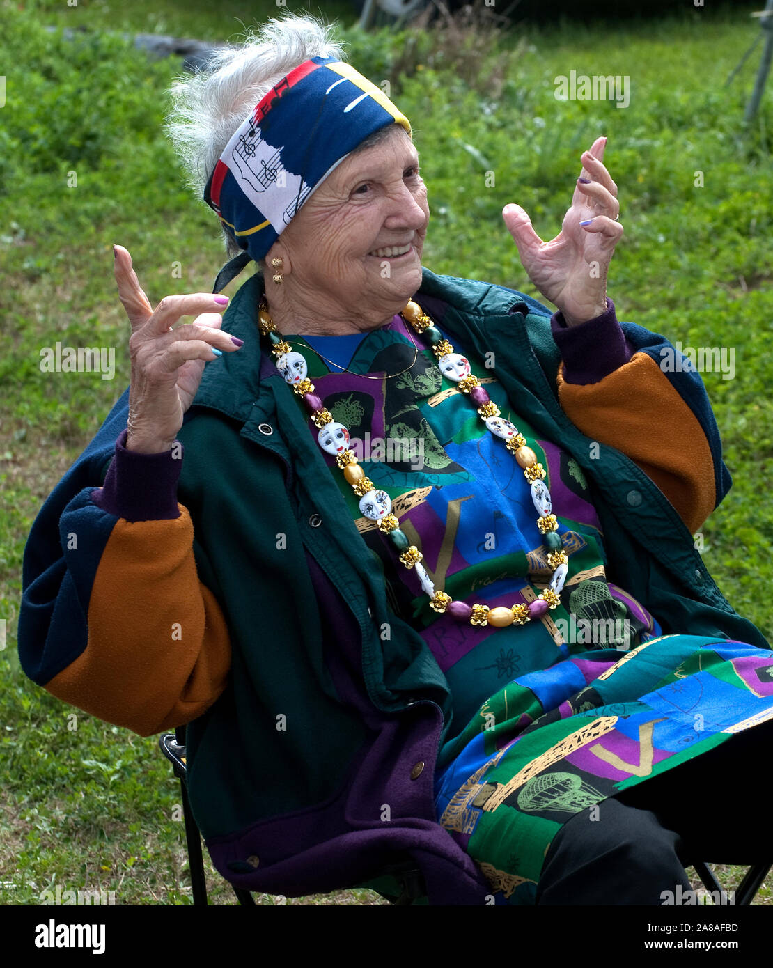 A woman waves to friends during the annual Mardi Gras parade March 6, 2011 in Grand Isle, Louisiana. Stock Photo