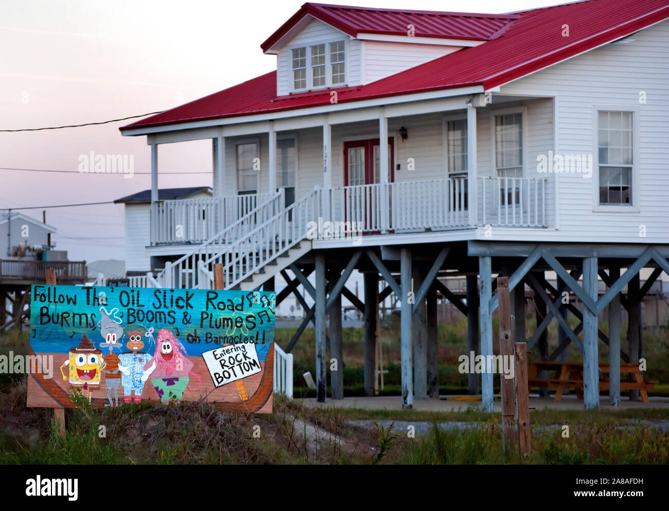 A hand-painted sign along Louisiana Highway 1 expresses Grand Isle residents' frustrations over the Deepwater Horizon BP oil spill Nov. 23, 2010. Stock Photo