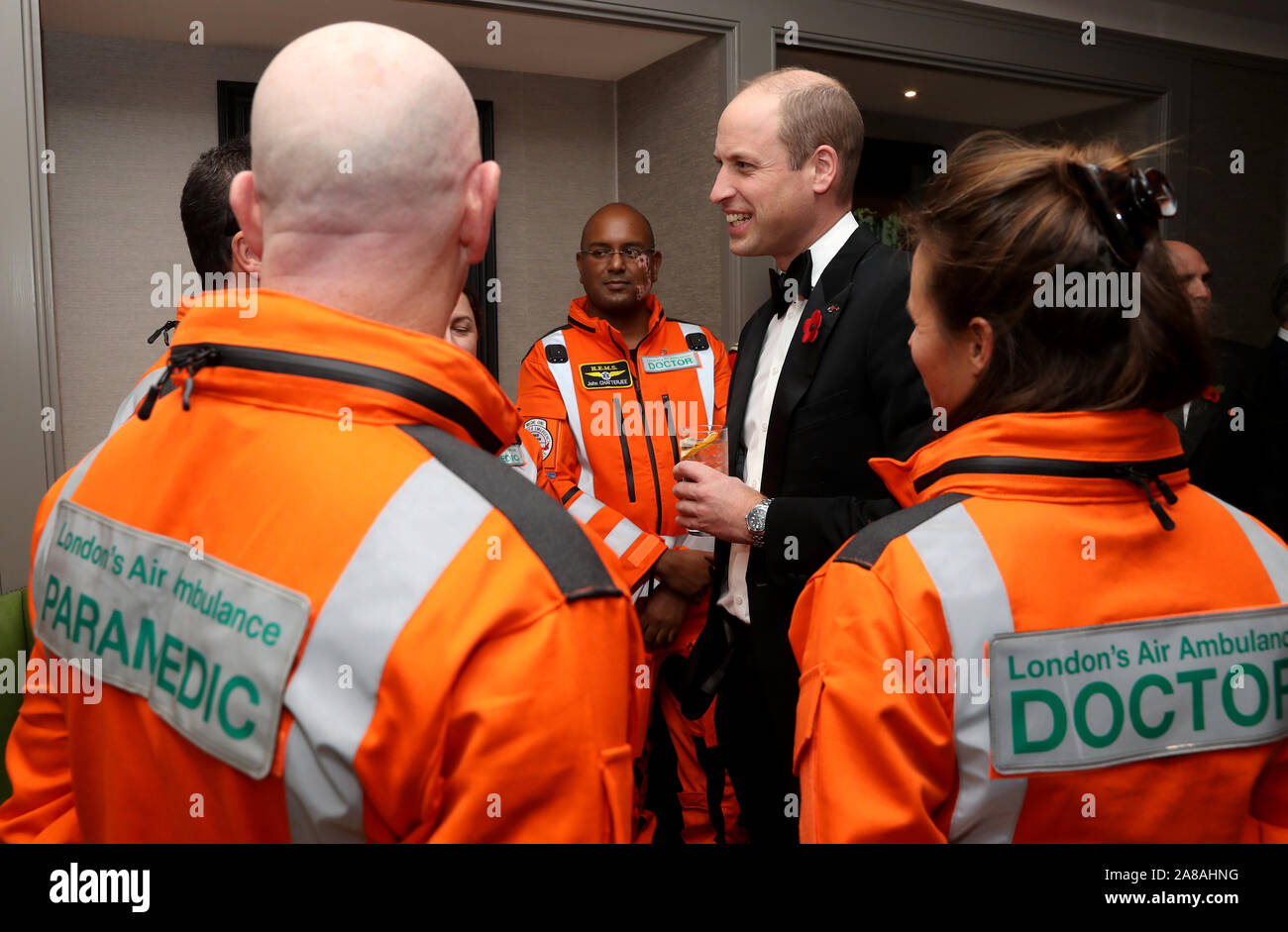 The Duke of Cambridge speaks with (left to right) Paramedic Steve Jones, Anaesthetic Consultant at Guys and St Thomas Hospitals Doctor John Chatterjee and Royal London Hospital Consultant in emergency medicine Doctor Flora Bird as he attends the London's Air Ambulance Charity gala at Rosewood London in Holborn. Stock Photo