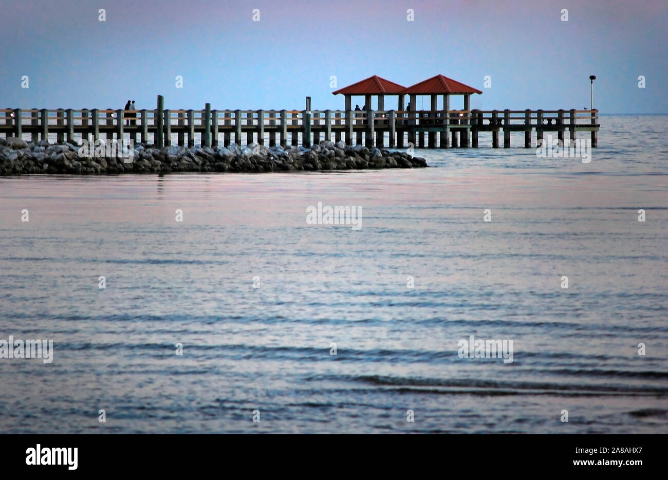 The sun sets in Gulfport, Mississippi on Dec. 24, 2010. Stock Photo