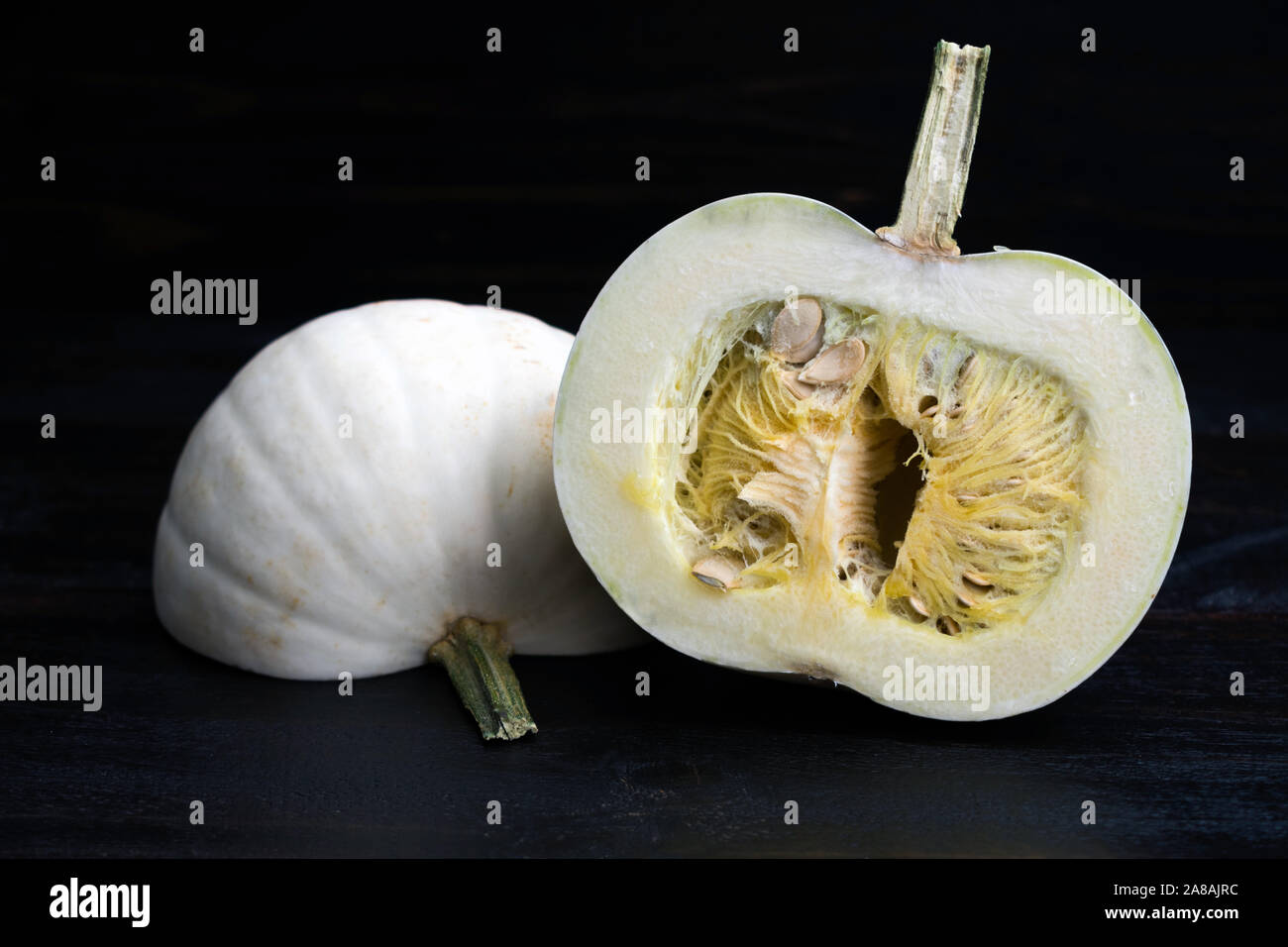 Raw white pumpkin that has been cut in half Stock Photo