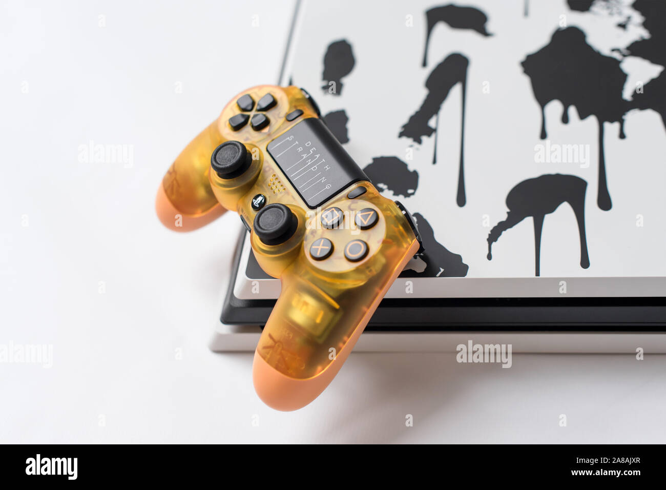 KIEV, UKRAINE - November 07, 2019: Death Stranding Limited Edition PS4 Pro.  Sony PlayStation 4 game console and transparent controller on white Stock  Photo - Alamy