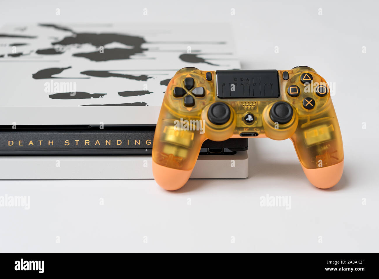 KIEV, UKRAINE - November 07, 2019: Death Stranding Limited Edition PS4 Pro.  Sony PlayStation 4 game console and transparent controller on white Stock  Photo - Alamy