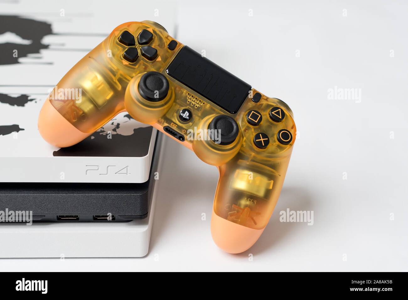 KIEV, UKRAINE - November 07, 2019: Death Stranding Limited Edition PS4 Pro.  Sony PlayStation 4 game console and transparent controller on white Stock  Photo - Alamy