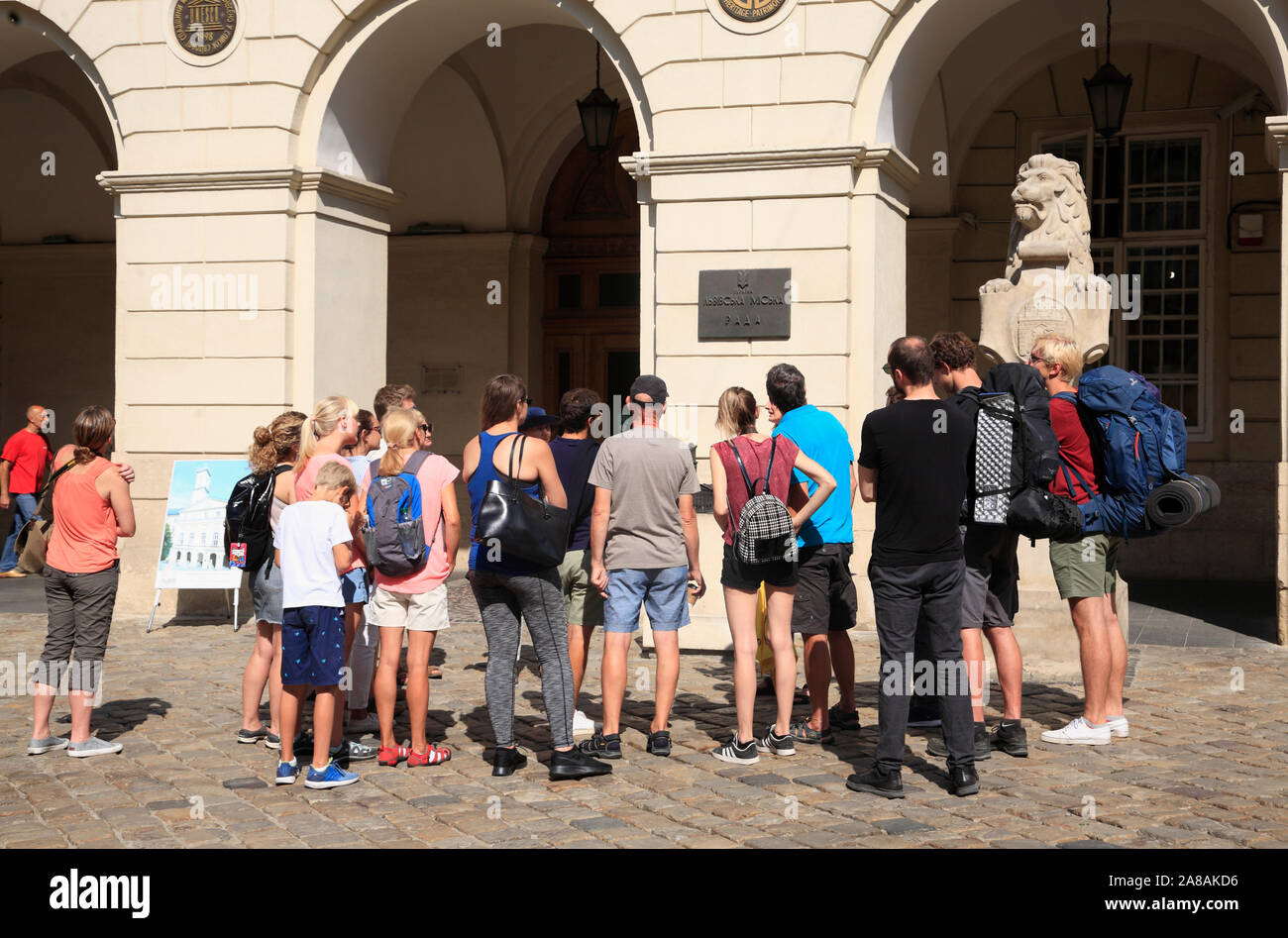 Guided sightseeing tour at town hall on market square Rynok, Lviv, Ukraine Stock Photo