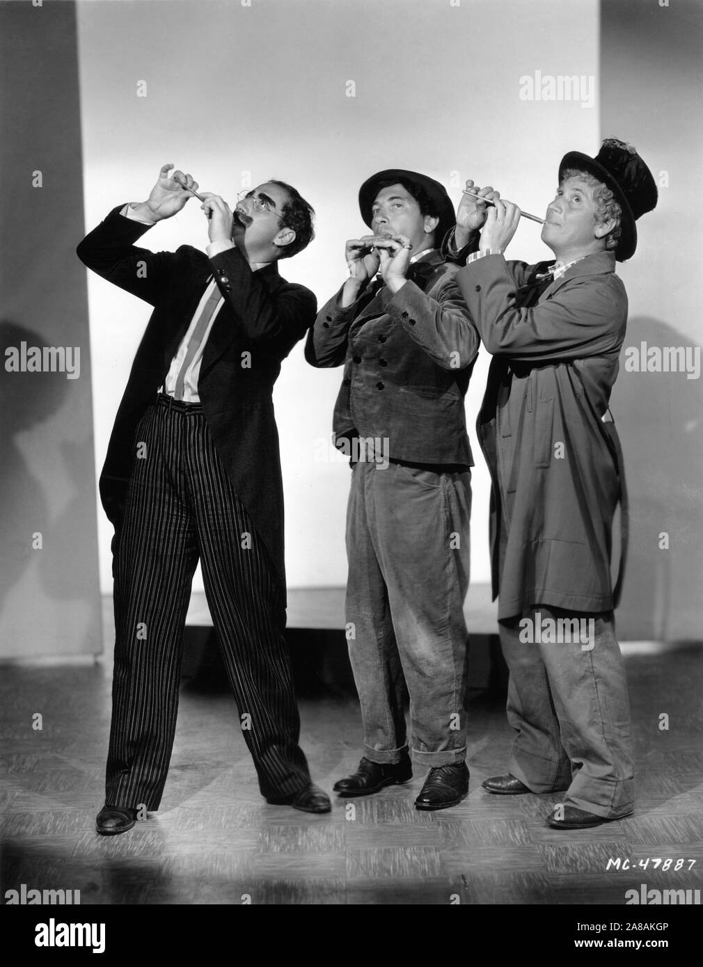 GROUCHO MARX CHICO MARX HARPO MARX THE MARX BROTHERS Portrait by Clarence Sinclair Bull for A NIGHT AT THE OPERA 1935 director Sam Wood screenplay George S. Kaufman and Morrie Ryskind producer Irving Thalberg Metro Goldwyn Mayer Stock Photo