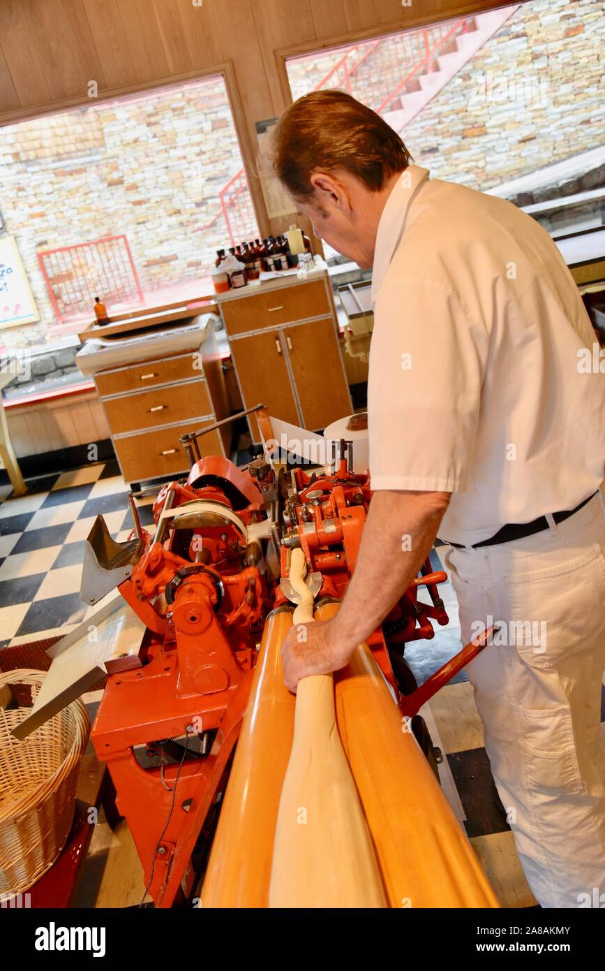 Making chewy salt water taffy candy at Ole Smoky Candy Kitchen, using