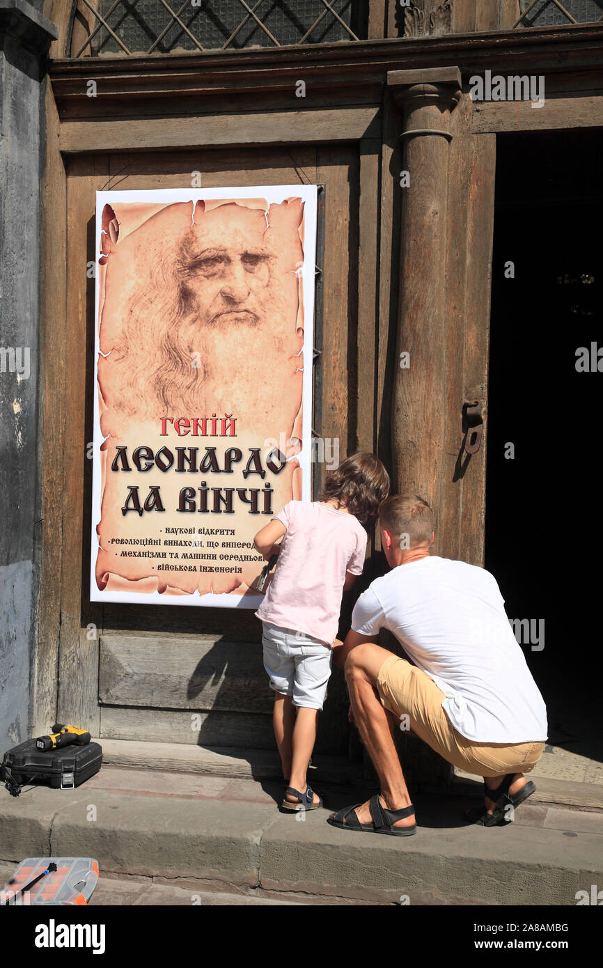 Father and son working together, market square Rynok, Lviv, Ukraine Stock Photo